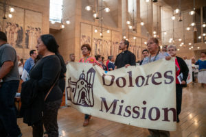 Members of the Dolores Mission in Los Angeles process in during the annual Mass in Recognition of All Immigrants on Sunday, Sept. 17 at the Cathedral of Our Lady of the Angels. (John Rueda/ADLA)