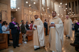 Father Claude Williams, left, pastor at Saints Peter & Paul Church in Wilmington, and Msgr. Antonio Cacciapuoti, right, pastor at the Cathedral of Our Lady of the Angels, process in during the annual Mass in Recognition of All Immigrants on Sunday, Sept. 17. (John Rueda/ADLA)
