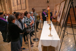 Parishioners look upon the relics of St. Junípero Serra, St. Frances Xavier Cabrini, St. John Baptist Scalabrini, Our Lady of Good Harvest and St. Toribio Romo that were on display following the Mass in Recognition of All Immigrants on Sunday, Sept. 17 at the Cathedral of Our Lady of the Angels. (John Rueda/ADLA)