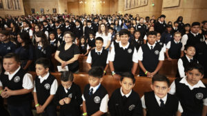 Catholic school students pack the Cathedral of Our Lady of the Angels on Oct. 17 for the annual Missionary Childhood Association Youth Mass. More than 1,700 students from 36 Catholic schools in the region attended. (Victor Alemán)