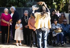 Members of the Gabrieleño San Gabriel Band of Mission Indians perform a blessing during a dedication for a new Native garden space and fountain at Mission San Gabriel Arcángel on Nov. 19. 
 (Victor Alemán)