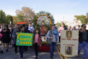 Parishioners from Santa Isabel Church in Los Angeles walk with their decorated float during the 92nd Procession and Mass honoring Our Lady of Guadalupe and St. Juan Diego on Dec. 3. (Sarah Yaklic)