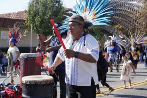 Drummers and dancers walk during the 92nd Procession and Mass honoring Our Lady of Guadalupe and St. Juan Diego at East LA College Stadium on Dec. 3. (Sarah Yaklic)