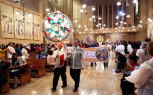 Parishioners from parishes across the Archdiocese of Los Angeles processed in before the annual Simbang Gabi kickoff Mass Dec. 15 at the Cathedral of Our Lady of the Angels. (Victor Alemán)
