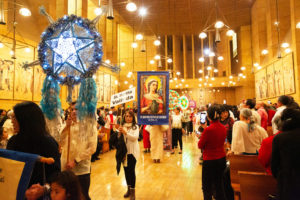 Parishioners from parishes across the Archdiocese of Los Angeles processed in before the annual Simbang Gabi kickoff Mass Dec. 15 at the Cathedral of Our Lady of the Angels. (Victor Alemán)