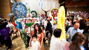 Filipino Catholics had a chance to inspect one another’s colorful ‘parols’ after the annual Simbang Gabi kickoff Mass Dec. 15 at the Cathedral of Our Lady of the Angels. (Victor Alemán)