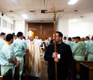 Los Angeles Archbishop José H. Gomez greets inmates at Men’s Central Jail in Los Angeles after celebrating Christmas Mass the morning of Dec. 25.  (Victor Alemán)