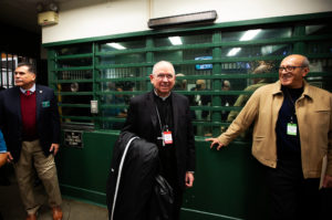 Los Angeles Archbishop José H. Gomez poses as he's escorted into Men’s Central Jail in Los Angeles where he celebrated Christmas Mass the morning of Dec. 25.  (Victor Alemán)