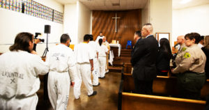 Los Angeles Archbishop José H. Gomez offers Communion to inmates at Men’s Central Jail in Los Angeles while celebrating Christmas Mass the morning of Dec. 25.  (Victor Alemán)