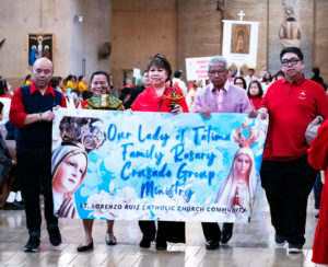 Filipino Catholics paraded into the cathedral during a procession to begin the Feast of Santo Niño Mass at the Cathedral of Our Lady of the Angels on Jan. 21. (Victor Alemán)