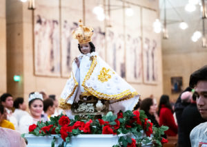 A Santo Niño was paraded into the cathedral during a procession to begin the Feast of Santo Niño Mass at the Cathedral of Our Lady of the Angels on Jan. 21. (Victor Alemán)