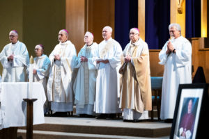 Archbishop José H. Gomez and concelebrating bishops and priests stand during the Feb. 24 memorial Mass for Auxiliary Bishop David O'Connell at Mission San Gabriel to mark the one-year anniversary of his death. (Victor Alemán)