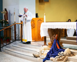 Msgr. Jarlath Cunnane speaks during the Feb. 24 memorial Mass for Auxiliary Bishop David O'Connell at Mission San Gabriel to mark the one-year anniversary of his death. (Victor Alemán)