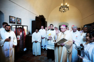 Archbishop José H. Gomez blesses the memorial exhibit following the Feb. 24 memorial Mass for Auxiliary Bishop David O'Connell at Mission San Gabriel to mark the one-year anniversary of his death. (Victor Alemán)