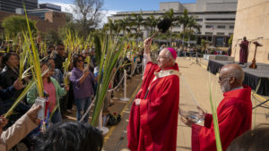 Archbishop José H. Gomez blesses the throng of Massgoers who celebrated Palm Sunday on March 24, the first of the several annual Holy Week liturgies at the Cathedral of Our Lady of the Angels. (John Rueda)