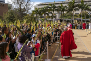 Archbishop José H. Gomez blesses parishioners in the outdoor plaza of the Cathedral of Our Lady of the Angels during the Palm Sunday celebration on March 24. (John Rueda)
