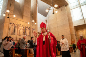 Archbishop José H. Gomez blesses parishioners during the Palm Sunday Mass on March 24. (John Rueda)