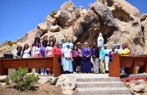 Parishioners and members of Catholic Daughters and Junior Catholic Daughters with Sacred Heart Church in Lancaster pose during a May Crowning event on May 11 at Lake Los Angeles. 
(Angie Paliza)