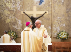 Deacon Gary Smith receives warm wishes from Archbishop Gomez during the permanent deacons ordination Mass. (Victor Alemán)