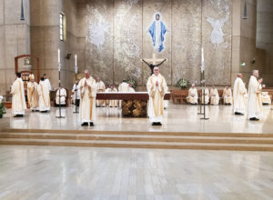 The eight men receive applause after receiving their vestments during the permanent deacon ordination Mass at the Cathedral of Our Lady of the Angels on June 8. (Victor Alemán)