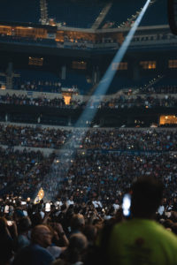 A spotlight shines on the monstrance displaying the Eucharist during the opening session of the National Eucharistic Congress on July 17. (Archdiocese of Los Angeles)