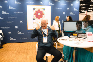 Jeffrey Morgan stops by the booth sponsored by the Archdiocese of LA in the National Eucharistic Congress exhibit hall. (Archdiocese of Los Angeles)