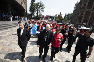 Archbishop José H. Gomez, right, and Msgr. Eduardo Chávez, co-founder of the Institute of Guadalupan Studies in Mexico City, led the procession to the basilica. (Victor Alemán)