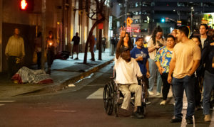 A man reacts during a Eucharistic Procession through downtown LA’s Skid Row on Saturday, July 27. (Victor Alemán)