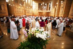 Deacons, their wives and loved ones congregate following a special Diaconate Mass at the Cathedral of Our Lady of the Angels on Aug. 10 to celebrate the feast day of St. Lawrence, the notable third-century deacon and martyr. (Victor Alemán)