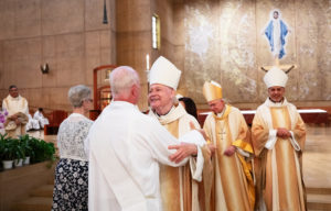 Auxiliary Bishop Matthew Elshoff greets a deacon following a special Diaconate Mass at the Cathedral of Our Lady of the Angels on Aug. 10 to celebrate the feast day of St. Lawrence, the notable third-century deacon and martyr. (Victor Alemán)