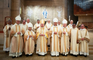 Archbishop José H. Gomez poses with auxiliary bishops Slawomir Szkredka, Brian Nunes, Albert Bahhuth, Matthew Elshoff and concelebrating priests following a special Diaconate Mass at the Cathedral of Our Lady of the Angels on Aug. 10 to celebrate the feast day of St. Lawrence, the notable third-century deacon and martyr. (Victor Alemán)