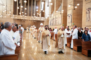 Priests and bishops precede Archbishop José H. Gomez to begin a special Diaconate Mass at the Cathedral of Our Lady of the Angels on Aug. 10 to celebrate the feast day of St. Lawrence, the notable third-century deacon and martyr. (Victor Alemán)