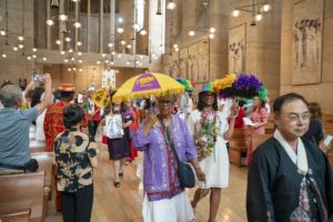 Parishioners process in to celebrate the many ethnic and cultural groups in the archdiocese during the 20th anniversary “One Mother, Many Peoples” Mass at the Cathedral of Our Lady of the Angels on Sept. 7. (John Rueda)