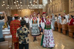 Parishioners process in to celebrate the many ethnic and cultural groups in the archdiocese during the 20th anniversary “One Mother, Many Peoples” Mass at the Cathedral of Our Lady of the Angels on Sept. 7. (John Rueda)