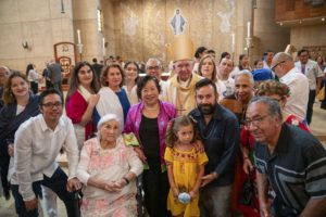 Archbishop Jose H. Gomez poses with a group after the 20th anniversary “One Mother, Many Peoples” Mass at the Cathedral of Our Lady of the Angels on Sept. 7. (John Rueda)