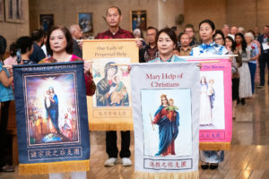 Parishioners process in to celebrate the many ethnic and cultural groups in the archdiocese during the 20th anniversary “One Mother, Many Peoples” Mass at the Cathedral of Our Lady of the Angels on Sept. 7. (Victor Alemán)