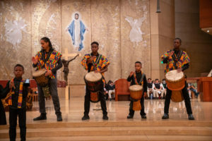 Drummers from Transfiguration School in Los Angeles performed at the front of the cathedral to start the annual Missionary Childhood Association Youth Appreciation Mass on Oct. 16. (John Rueda) 