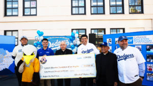 From left: Father Ramon Reyes, associate pastor at Incarnation Church, Adrien Lopez, of Catholic Education Foundation of Los Angeles, Archbishop José H. Gomez, Paul Escala, senior director and Superintendent of Catholic Schools, Father Rodel Balagtas, pastor at Incarnation Church, and Incarnation School Principal Colby Boysen. A check was presented during an event on Nov. 8 to celebrate funds raised for Catholic Education Foundation of Los Angeles thanks to the Dodgers winning the World Series. (Victor Alemán)