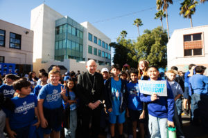 Los Angeles Archbishop José H. Gomez poses with students during a celebratory event at Incarnation School in Glendale on Nov. 8 to celebrate funds raised for Catholic Education Foundation of Los Angeles thanks to the Dodgers winning the World Series. (Victor Alemán)