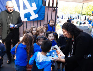 Students received Dodgers-themed donuts from Randy's Donuts during an event at Incarnation School in Glendale on Nov. 8 to celebrate funds raised for Catholic Education Foundation of Los Angeles thanks to the Dodgers winning the World Series.(Victor Alemán)