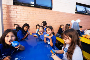 Students received Dodgers-themed donuts from Randy's Donuts during an event at Incarnation School in Glendale on Nov. 8 to celebrate funds raised for Catholic Education Foundation of Los Angeles thanks to the Dodgers winning the World Series.(Victor Alemán)