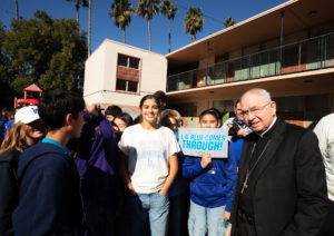 Los Angeles Archbishop José H. Gomez poses with students during a celebratory event at Incarnation School in Glendale on Nov. 8 to celebrate funds raised for Catholic Education Foundation of Los Angeles thanks to the Dodgers winning the World Series. (Victor Alemán)