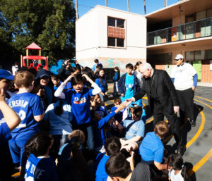 Los Angeles Archbishop José H. Gomez interacts with students during a celebratory event at Incarnation School in Glendale on Nov. 8 to celebrate funds raised for Catholic Education Foundation of Los Angeles thanks to the Dodgers winning the World Series. (Victor Alemán)