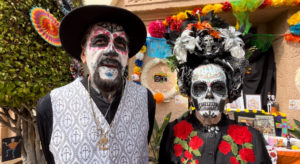 Héctor and Irma Mosqueda dressed up for a Día de los Muertos event at Calvary Cemetery in East LA on Oct. 26 to honor their son who is buried there. (Maria Hurtado)