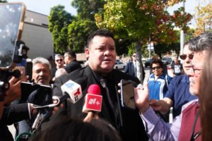 Fernando Valenzuela Jr. speaks to reporters following his father’s funeral Mass on Nov. 6.. (Victor Alemán)