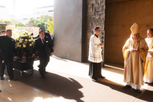 Los Angeles Archbishop José H. Gomez prepares to process in with the casket of Dodgers legend Fernando Valenzuela during his funeral Mass on Nov. 6 at the Cathedral of Our Lady of the Angels. (Victor Alemán)