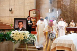 Los Angeles Archbishop José H. Gomez waves incense over the casket of Dodgers legend Fernando Valenzuela during his funeral Mass on Nov. 6 at the Cathedral of Our Lady of the Angels. (Victor Alemán)