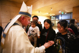 Archbishop José H. Gomez blesses items following the Las Mañanitas vigil celebrating Our Lady of Guadalupe on Dec. 11. (Victor Alemán) 