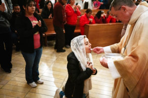 Attendees receive Communion during the annual Requiem Mass for the Unborn, the conclusion to the OneLife LA celebration at the Cathedral of Our Lady of the Angels on Jan. 18. (Victor Alemán)