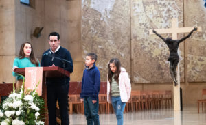 Rodrigo Gonzalez speaks to the OneLife LA crowd on Jan. 18 with his wife, Diana, and children Isaac and Penelope. (Victor Alemán)